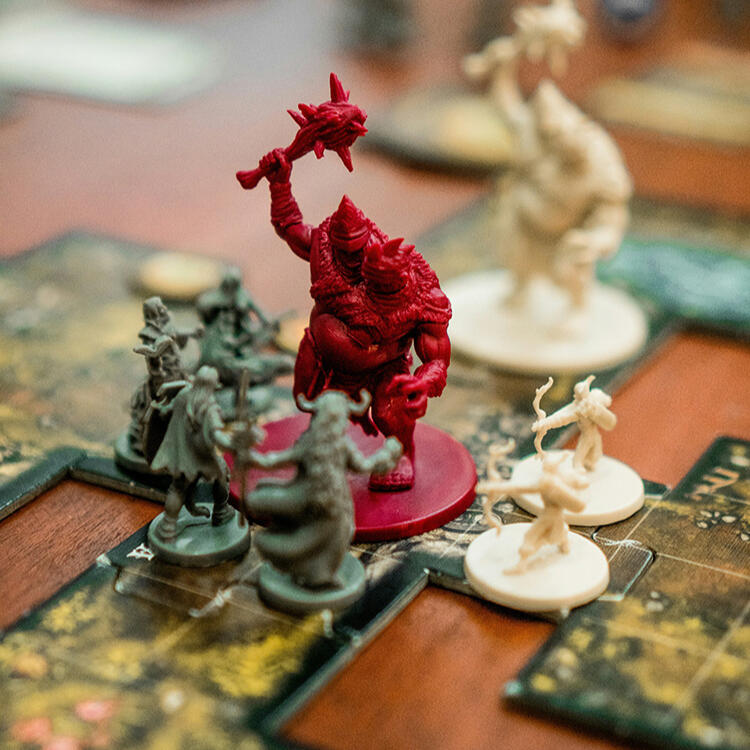 a group of plastic mini figurines on a gaming board