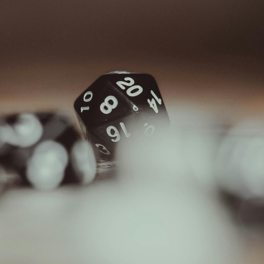 Black 20 sided die with the 20 showing clearly